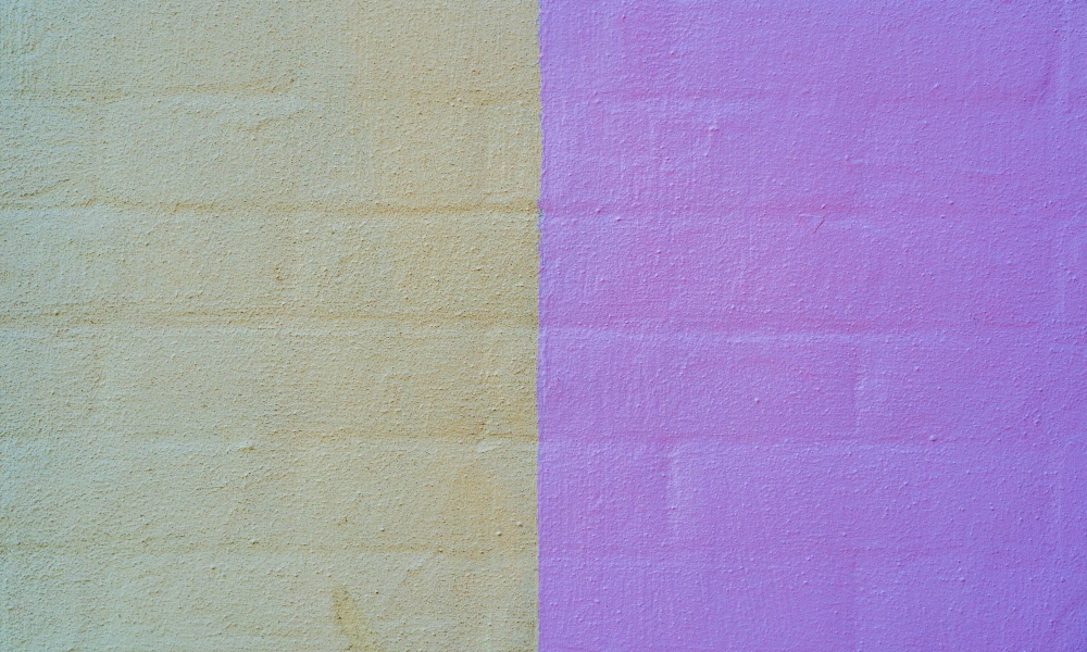 half and hald beige and purple painted wall 